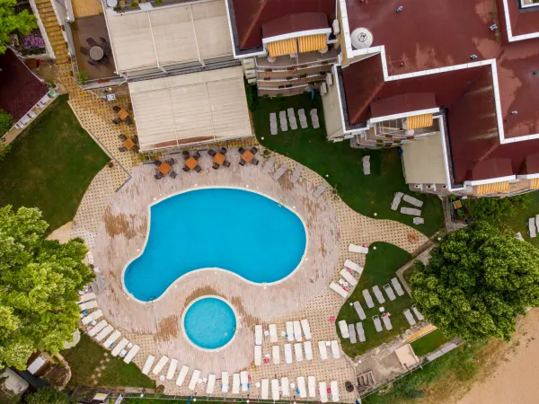 aerial-view-of-swimming-pool-with-sunbeds-at-hotel-2025-03-13-04-56-44-utc-691596f3ad42f