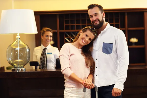 couple-at-reception-desk-in-hotel-2025-01-09-08-29-13-utc-691597d2343bf