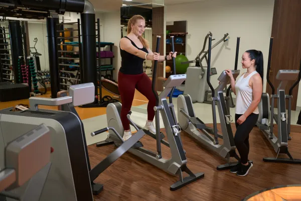 two-women-are-in-the-gym-of-a-fitness-clinic-2025-03-05-14-48-53-utc-6915962d2d1a4