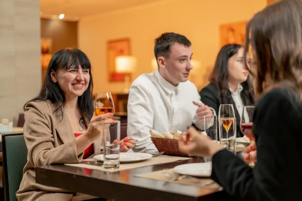 work-colleagues-in-a-restaurant-celebrating-conclu-2024-11-29-14-55-00-utc-691596cea89b2